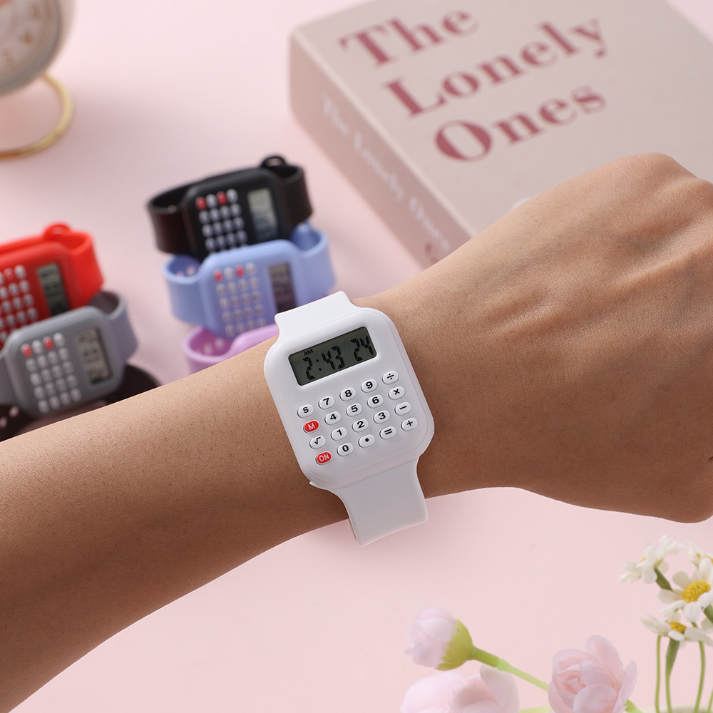 Digital calculator watch with LCD time and date display