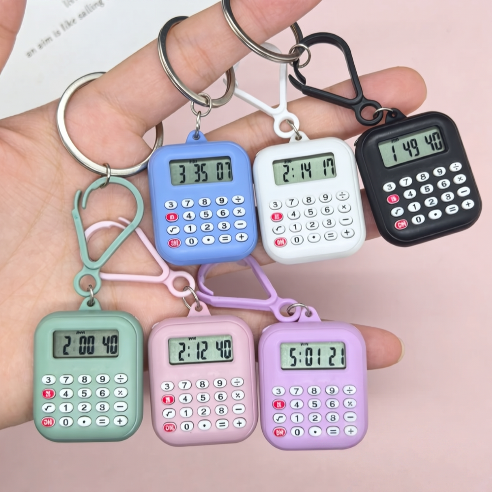 Mini calculator keychain clipped to a school bag