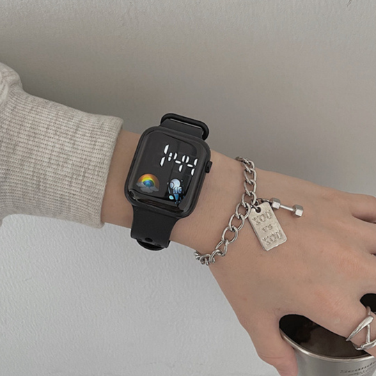 Space-themed LED watch with playful colorful astronaut icon